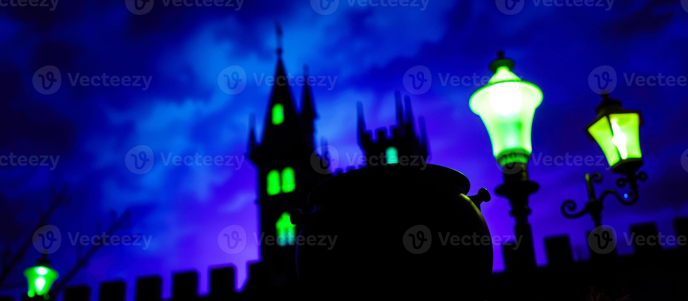 black cauldron stands before a glowing green streetlight a tall dark building photo