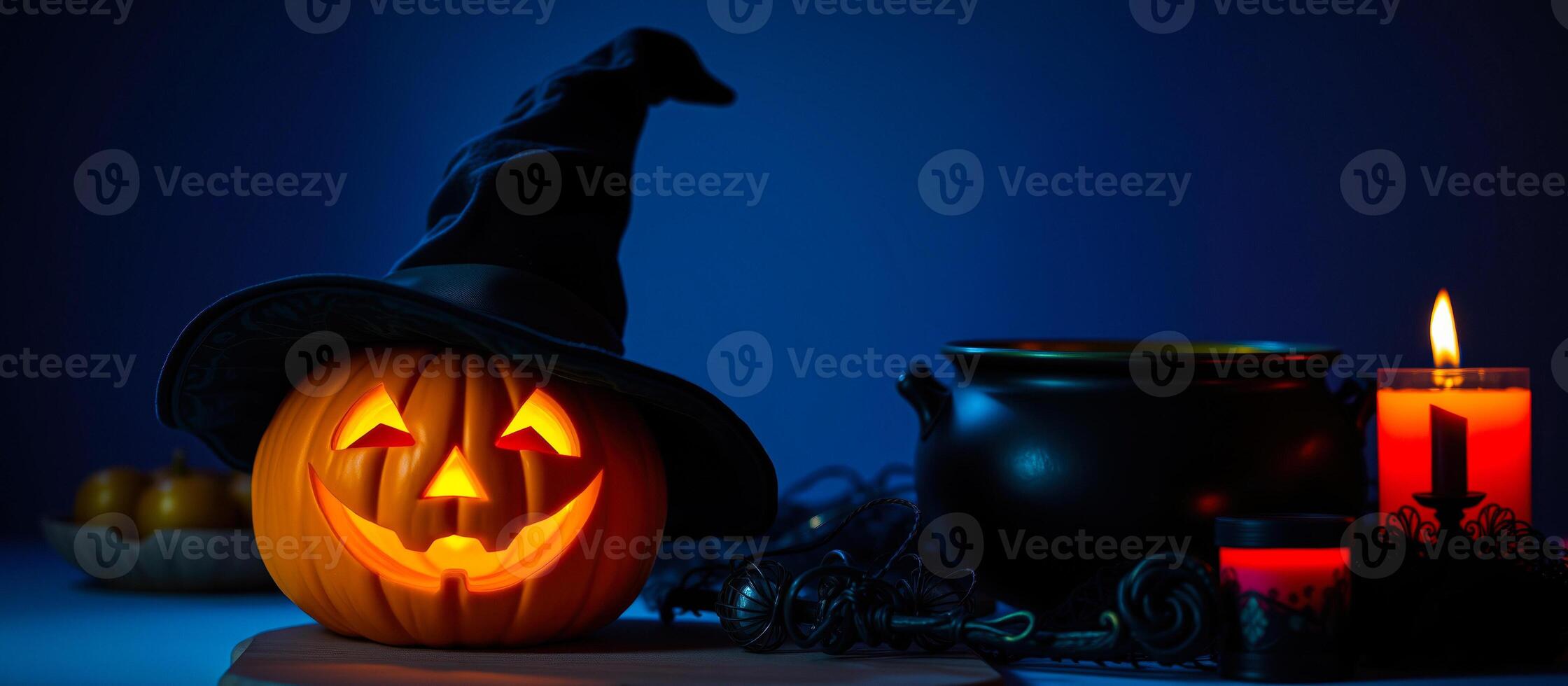 glowing jack-o'-lantern with a witch's hat festive halloween decor photo