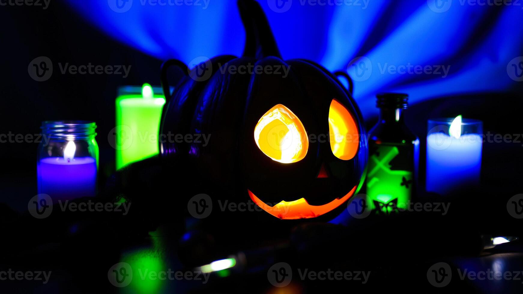 glowing pumpkin with candles photo