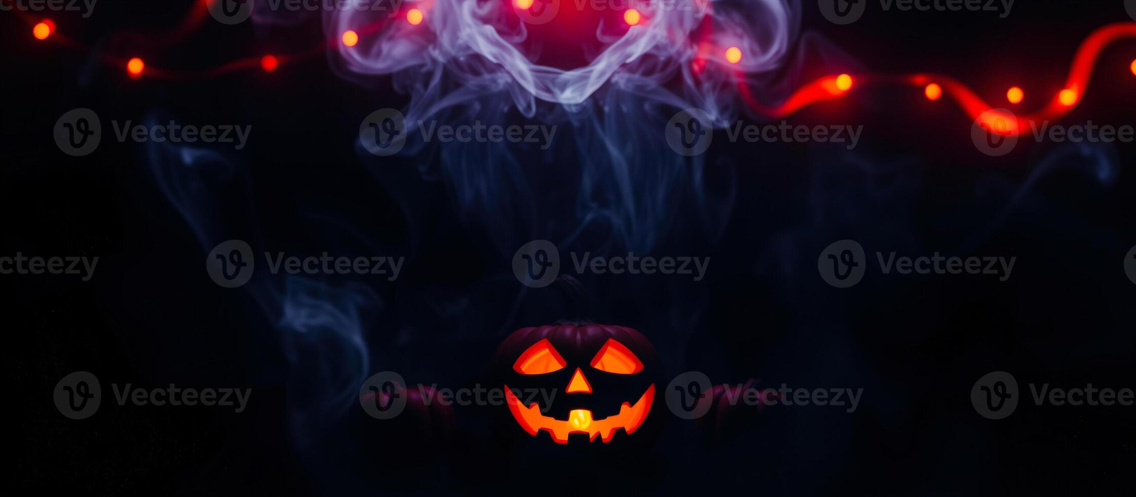 glowing jack-o'-lantern with smoke red lights photo