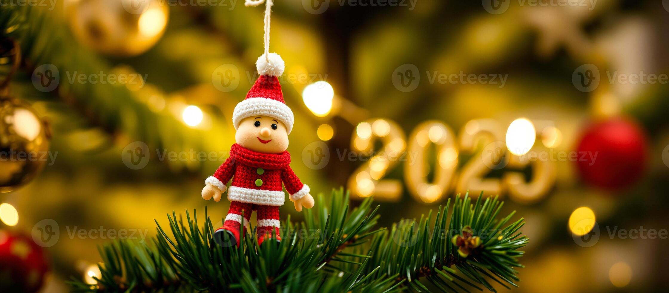 knitted santa ornament adorns a christmas tree photo