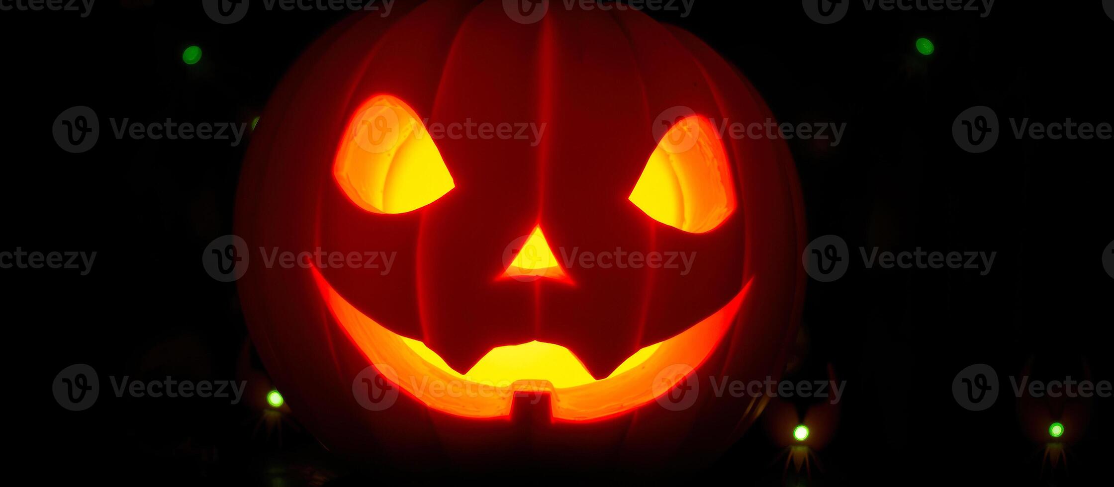 glowing pumpkin with a menacing grin photo