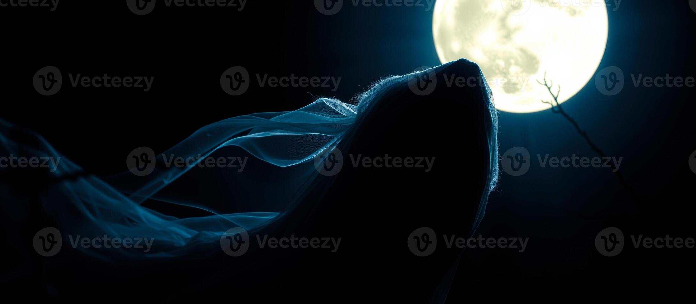 shadowy figure stands under the light the full moon photo