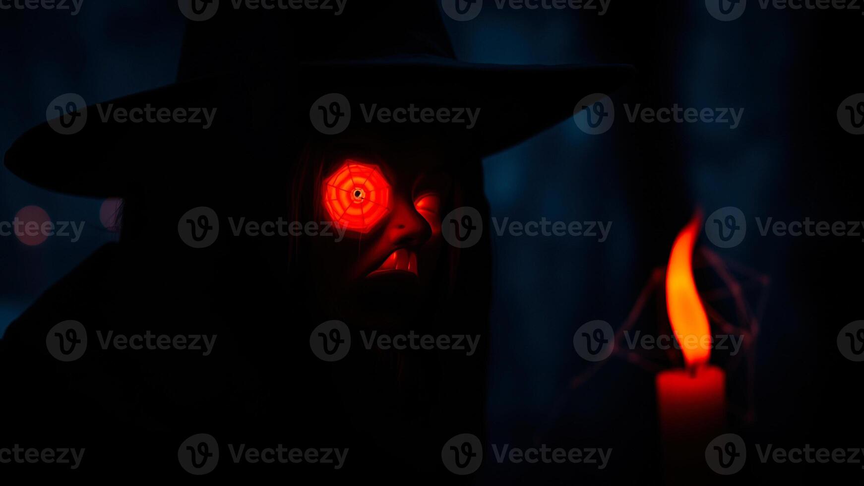 figure with a glowing red eye stands a dark forest photo