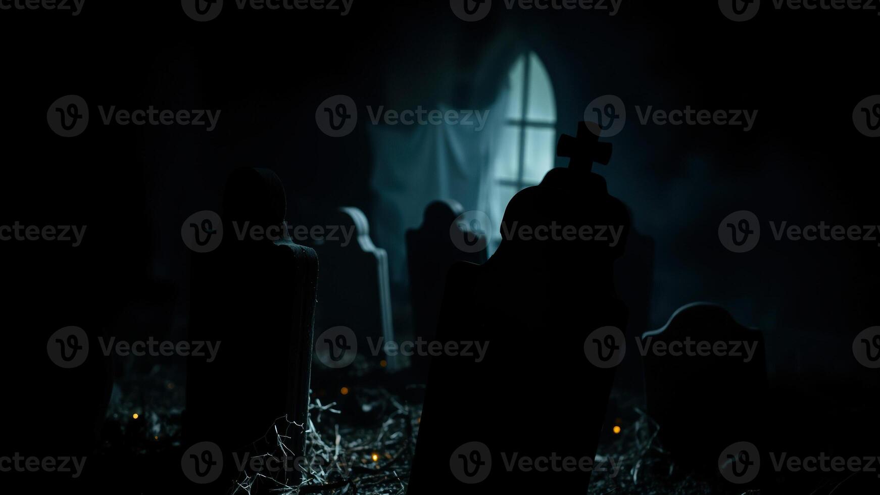 single window illuminates a dark graveyard photo