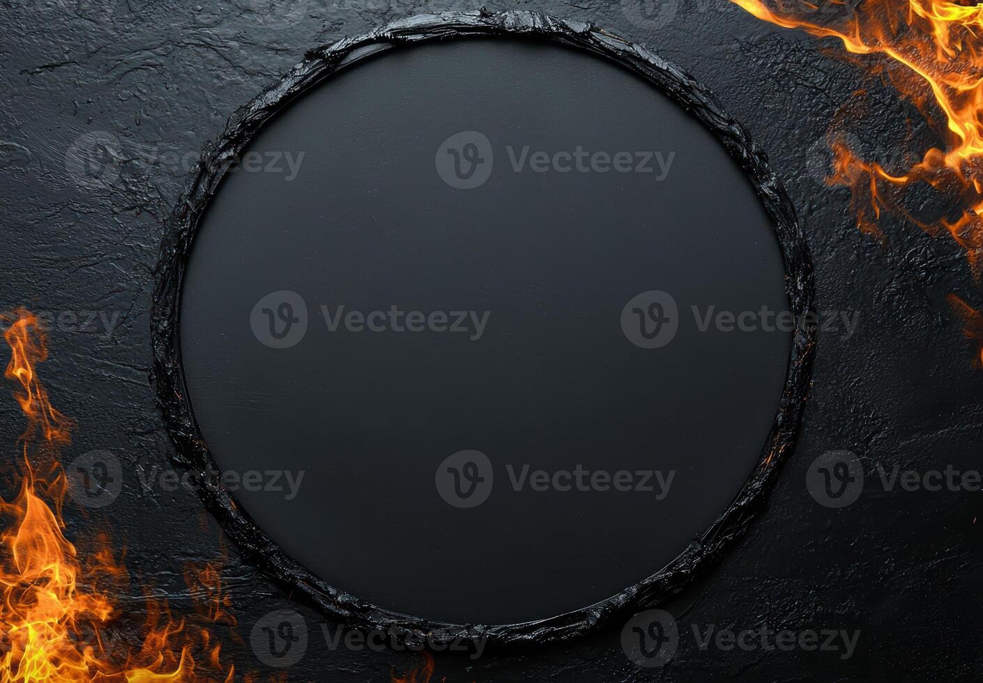 Fiery dark circle frame on black background photo