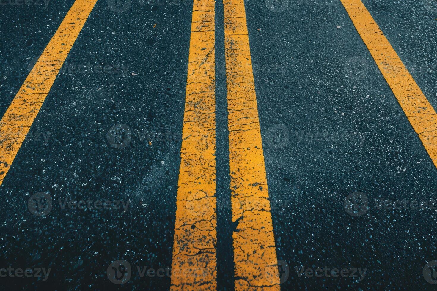 Wet road with yellow lines photo