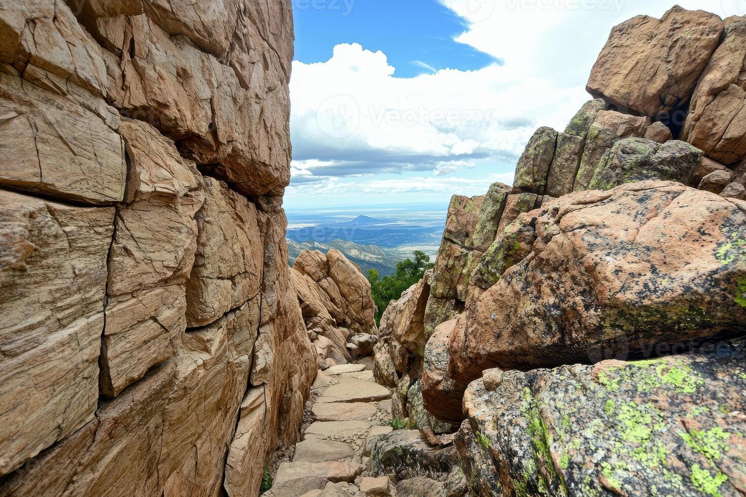 Rugged mountain trail with scenic overlook photo