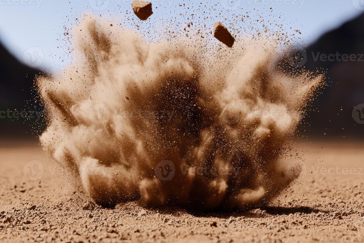 Explosive dust cloud in desert photo