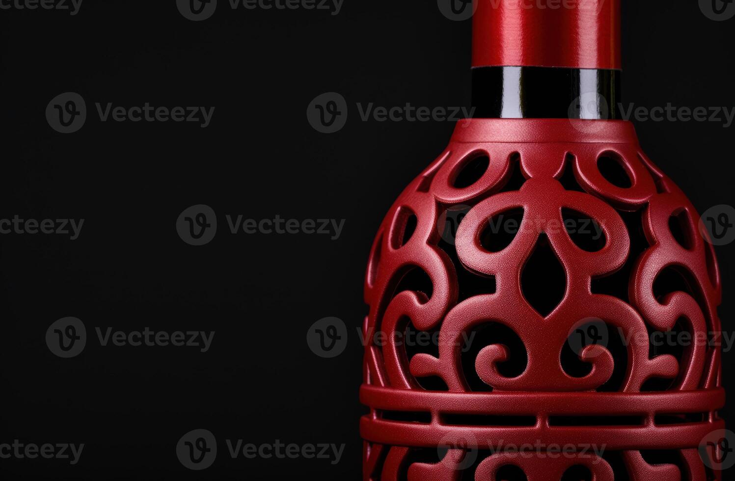 Decorative red ceramic vase with intricate pattern photo