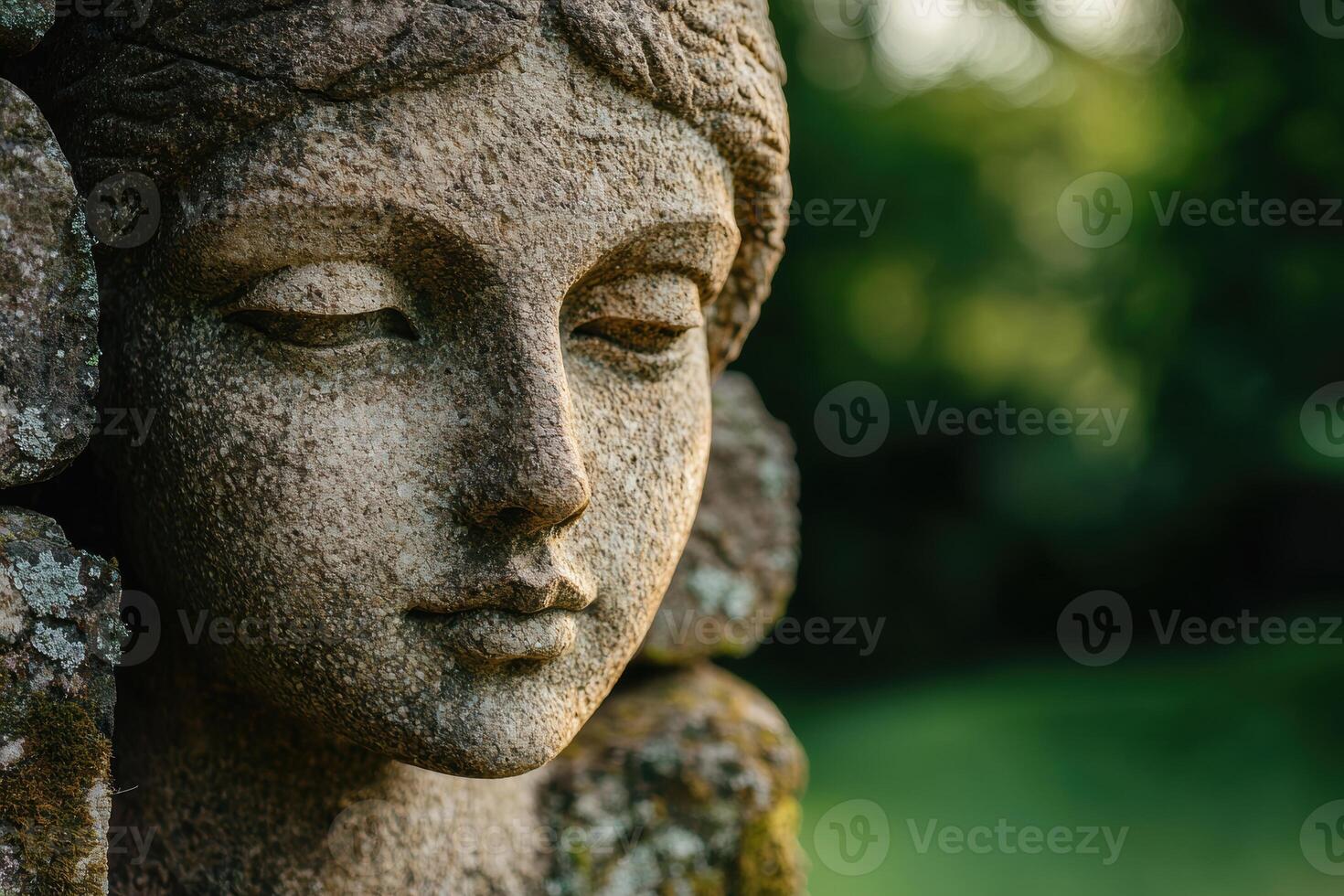 Serene stone buddha statue in nature photo