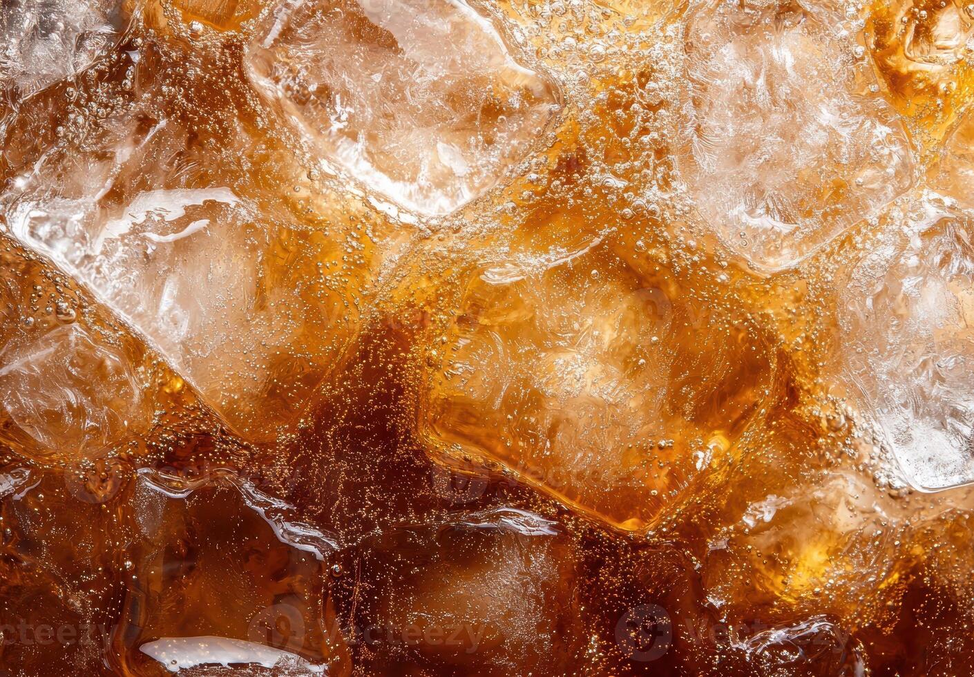Closeup of amber colored honey dripping with bubbles photo
