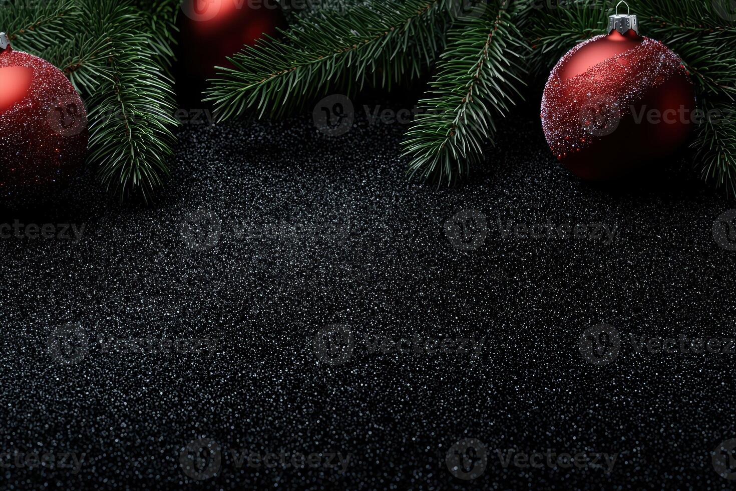 Festive Christmas ornaments and pine branches on a black glittery background photo