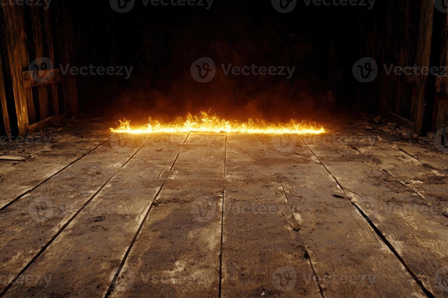 Blazing fire on wooden floor in dark room photo