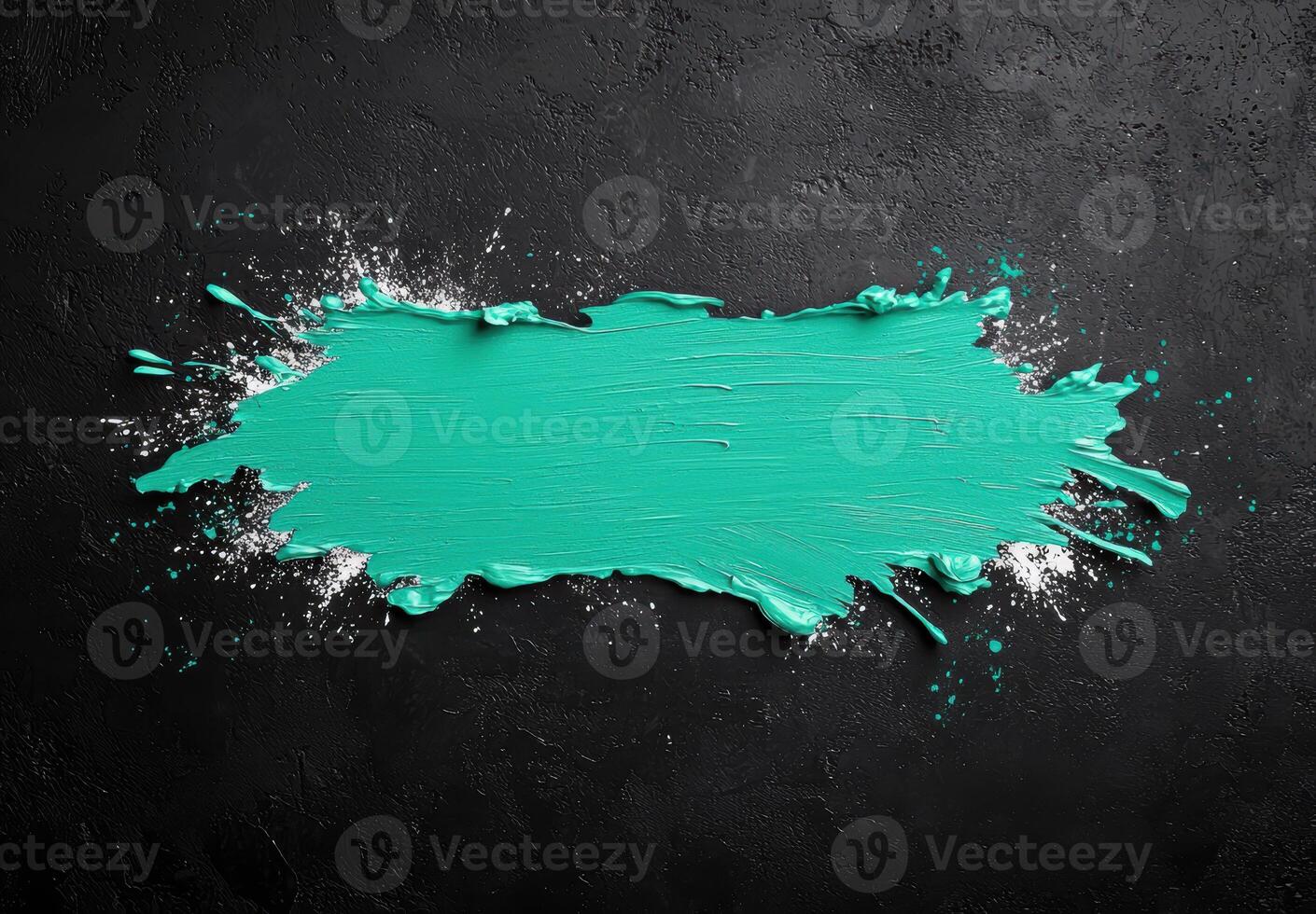 Vibrant teal paint splash on black background photo