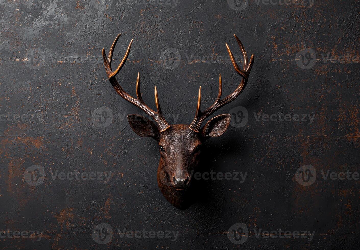 Majestic deer head mounted on dark background photo
