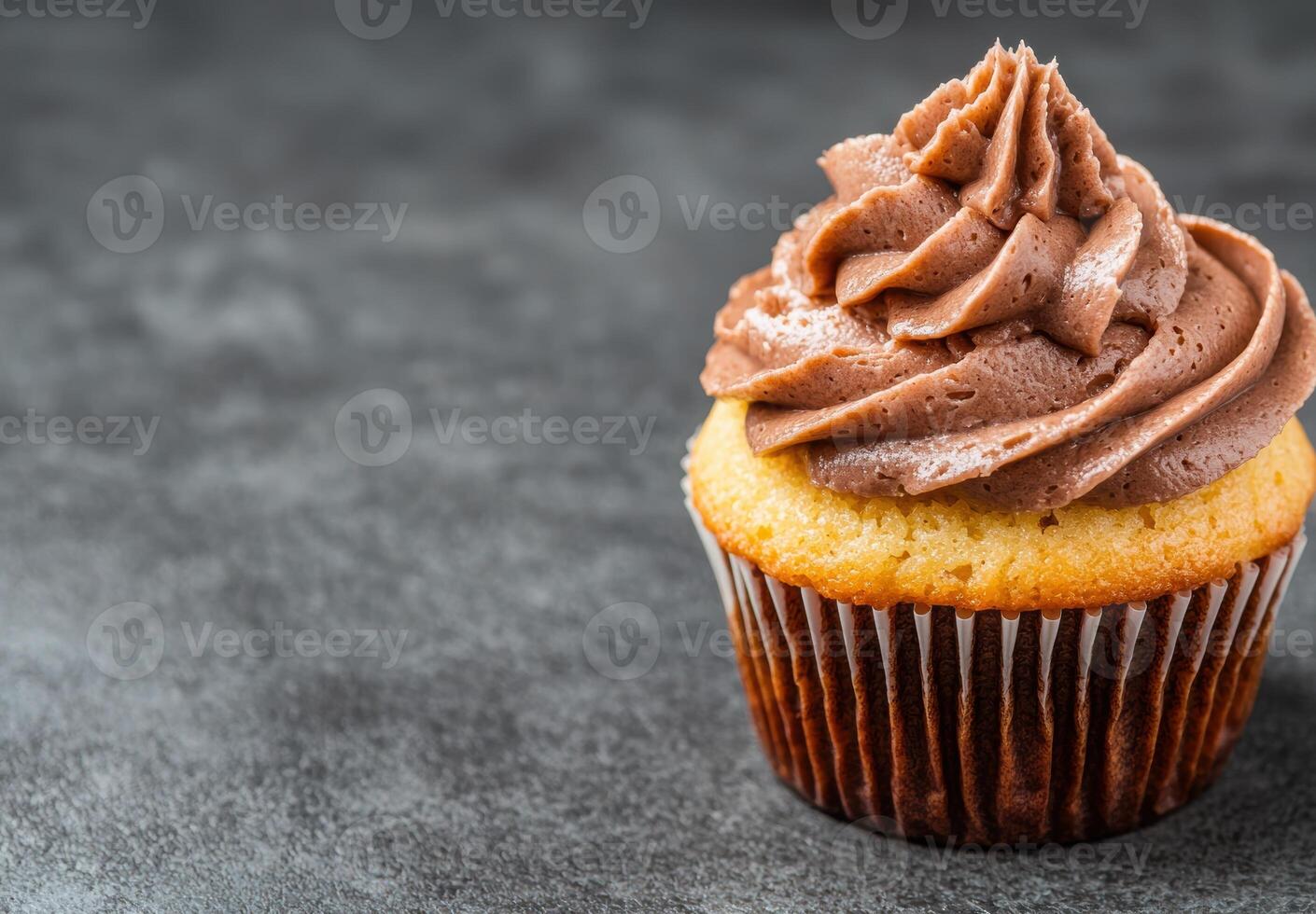 Delicious chocolate cupcake with creamy frosting photo