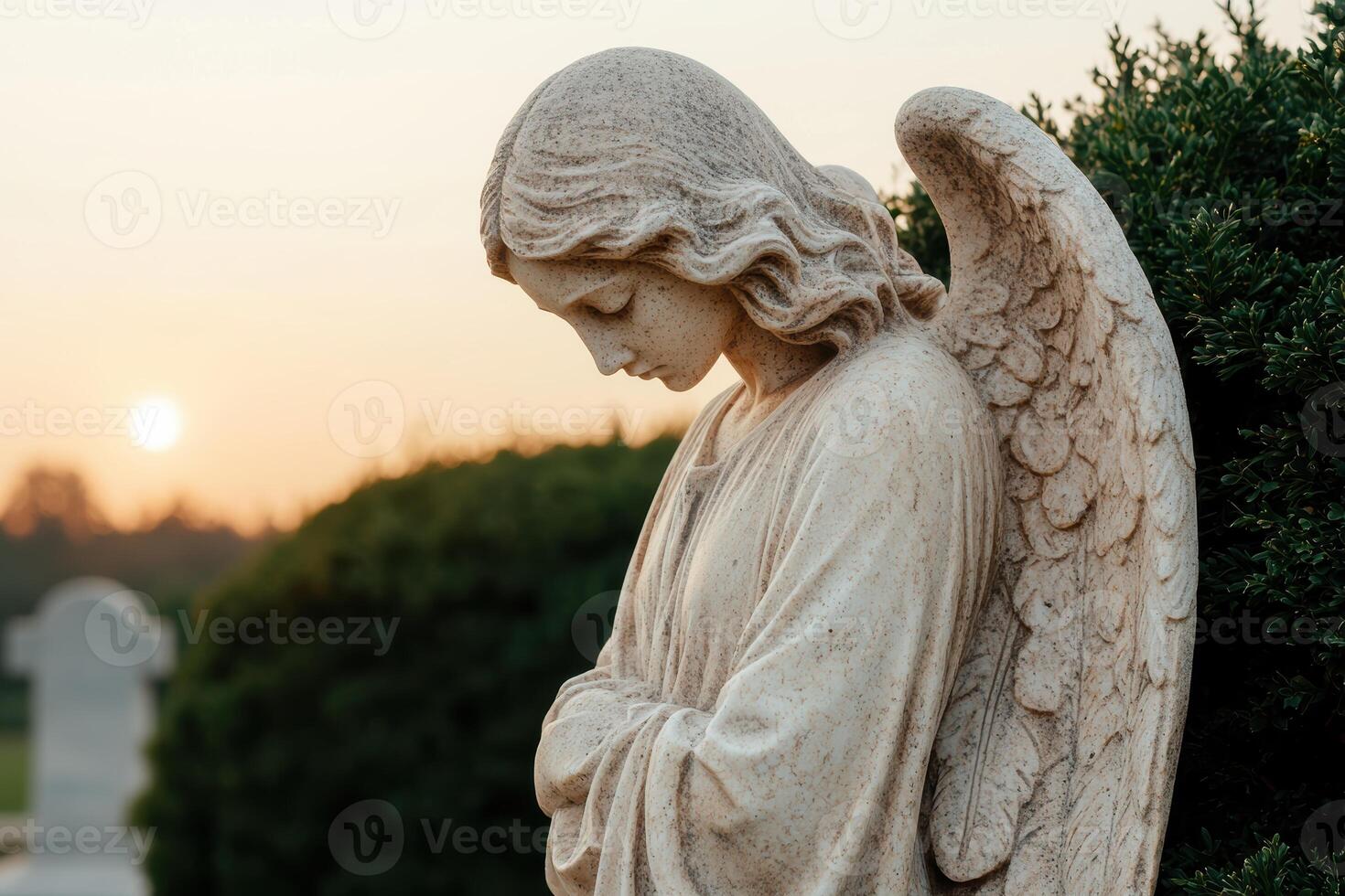 Serene angel statue at sunset photo