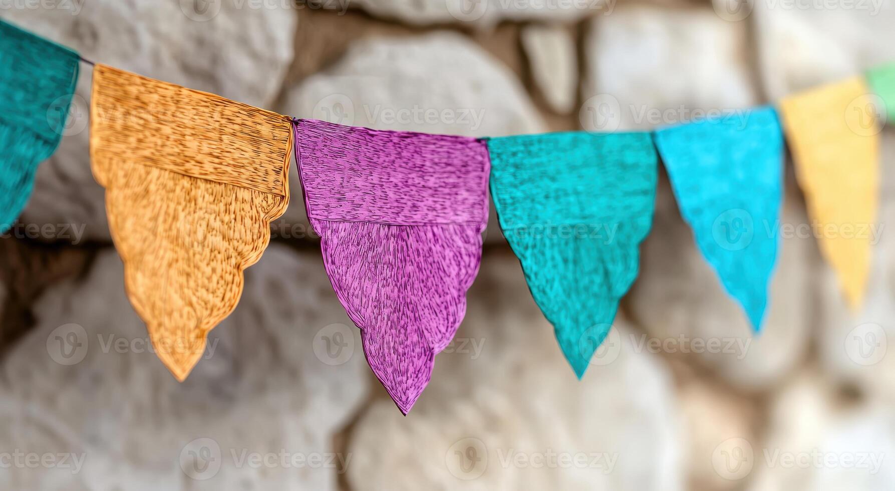 Colorful textile flags hanging on a wall photo
