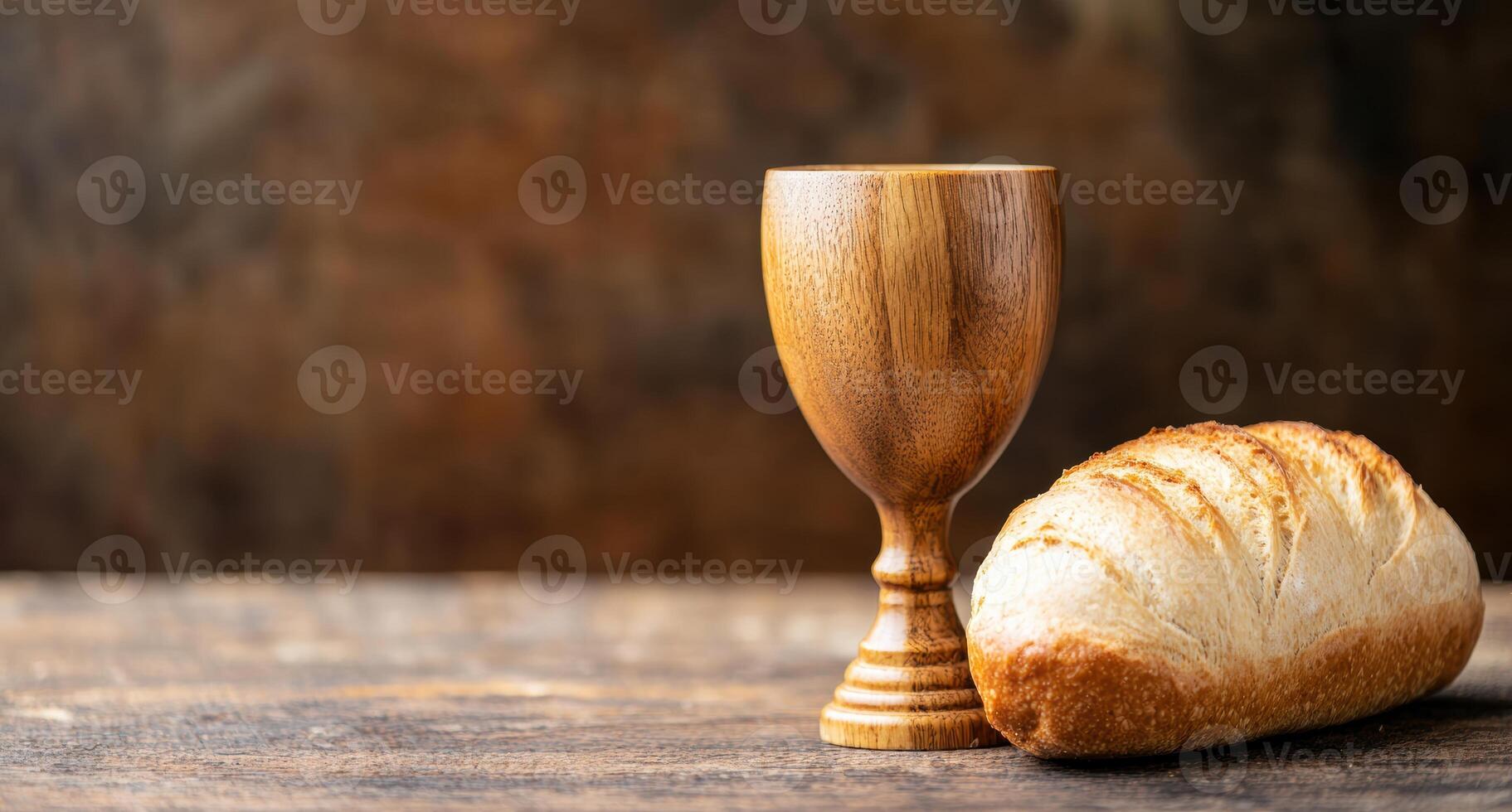 wooden cup and fresh bread on rustic table photo