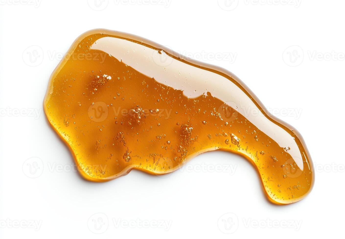 Gooey honey dripping from a spoon photo