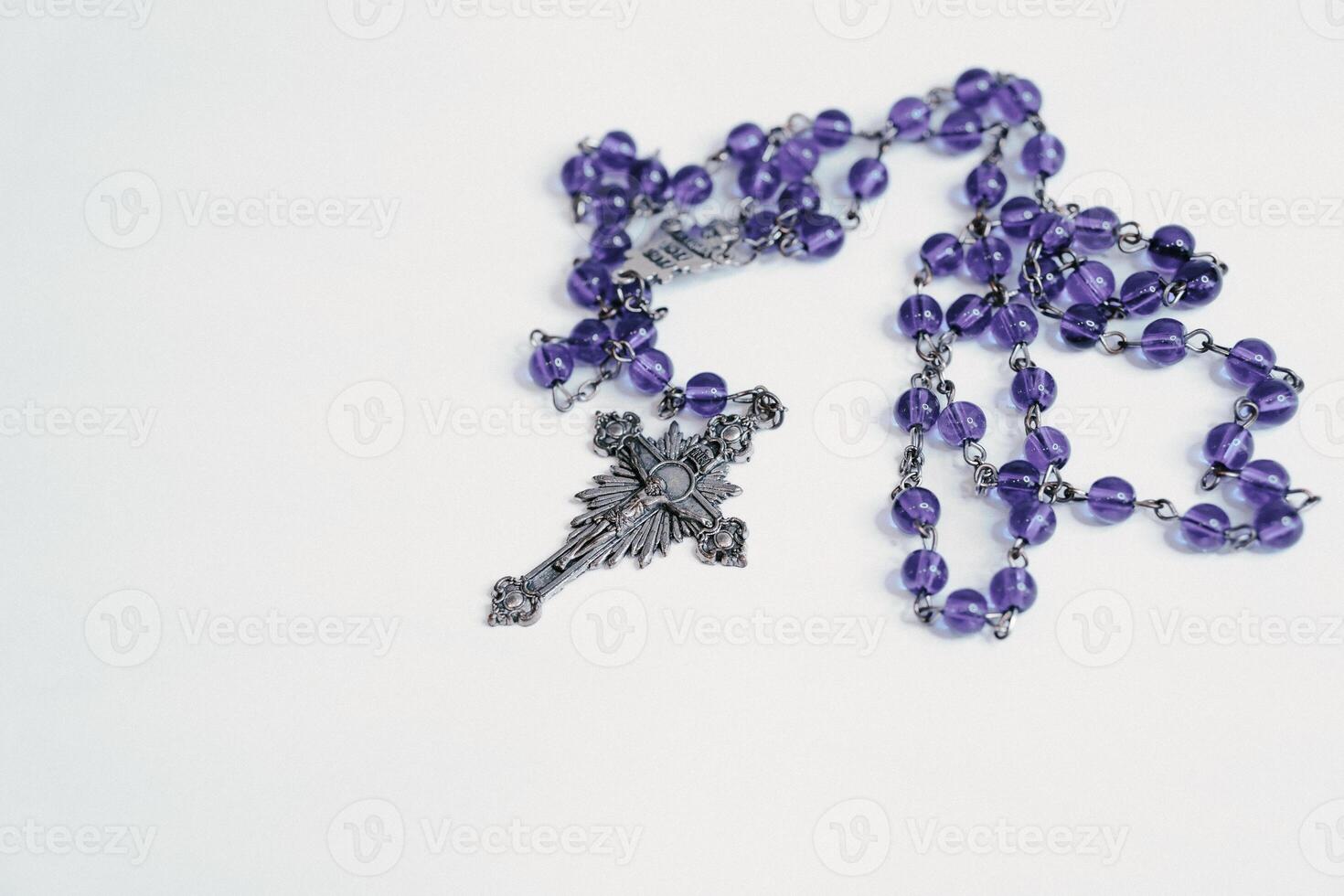 Rosary on plain white background photo
