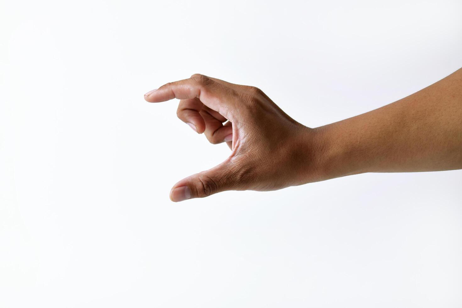 A man's hand is taking something on a white background photo