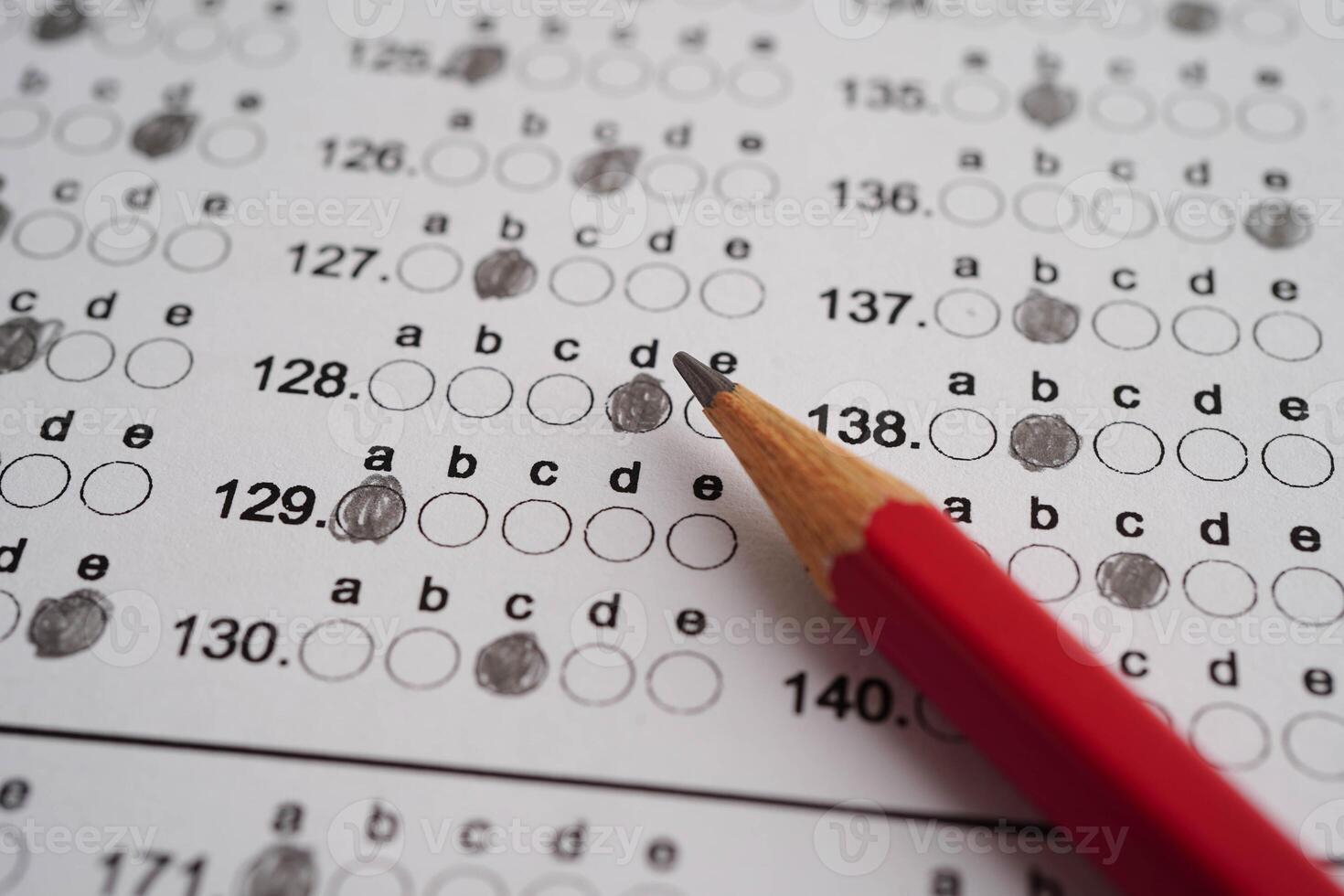 Answer sheets with pencil drawing fill to select choice, education concept. photo