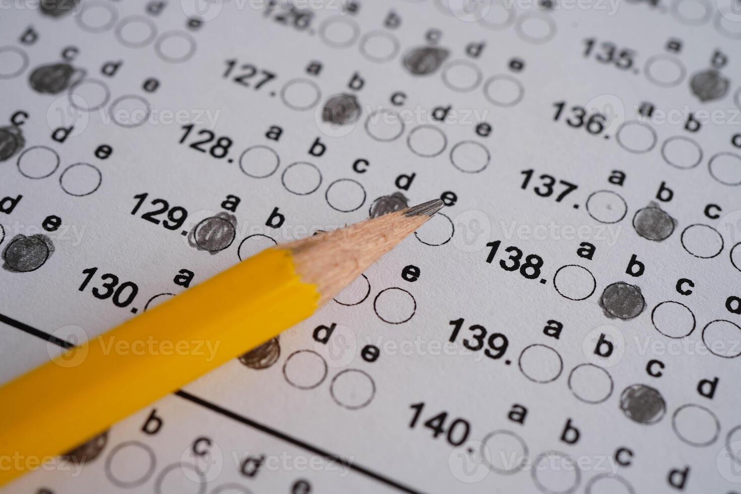 Answer sheets with pencil drawing fill to select choice, education concept. photo