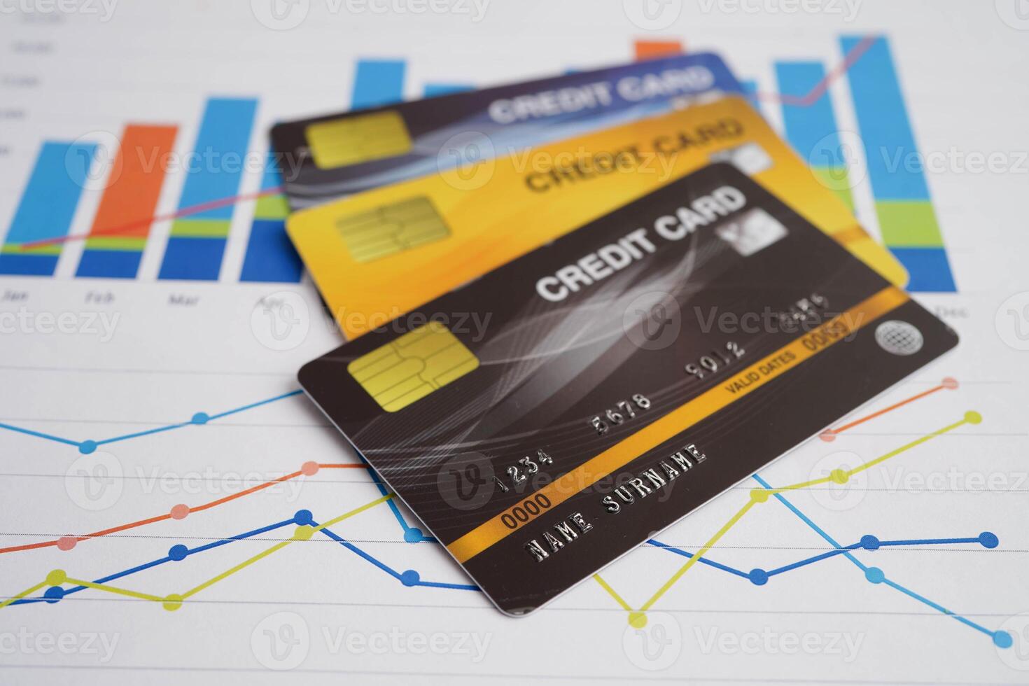 Credit card on graph paper for online shopping, security finance business. photo
