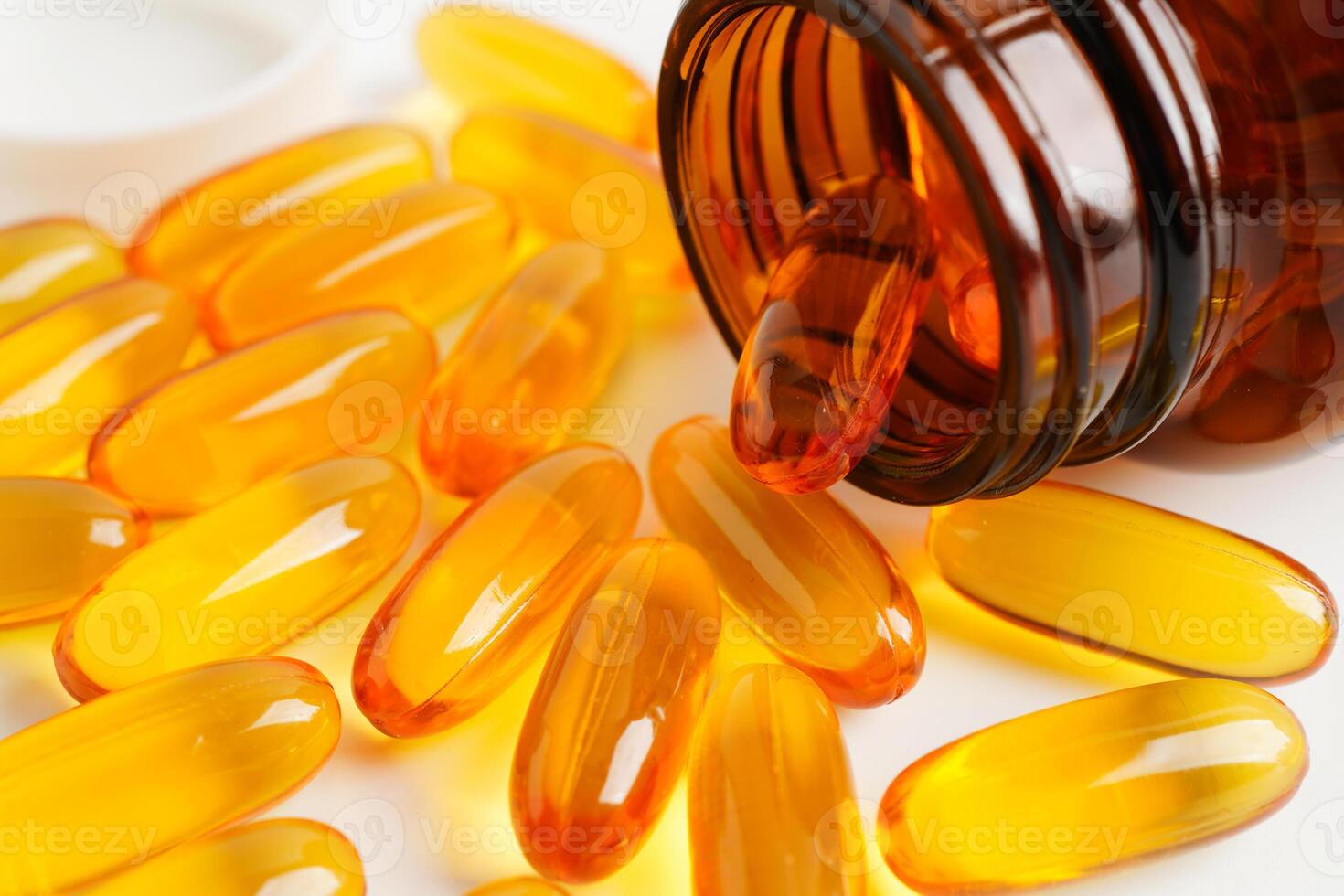 Fish oil or Cod liver oil gel in capsules with omega 3 vitamins, supplementary healthy food. photo