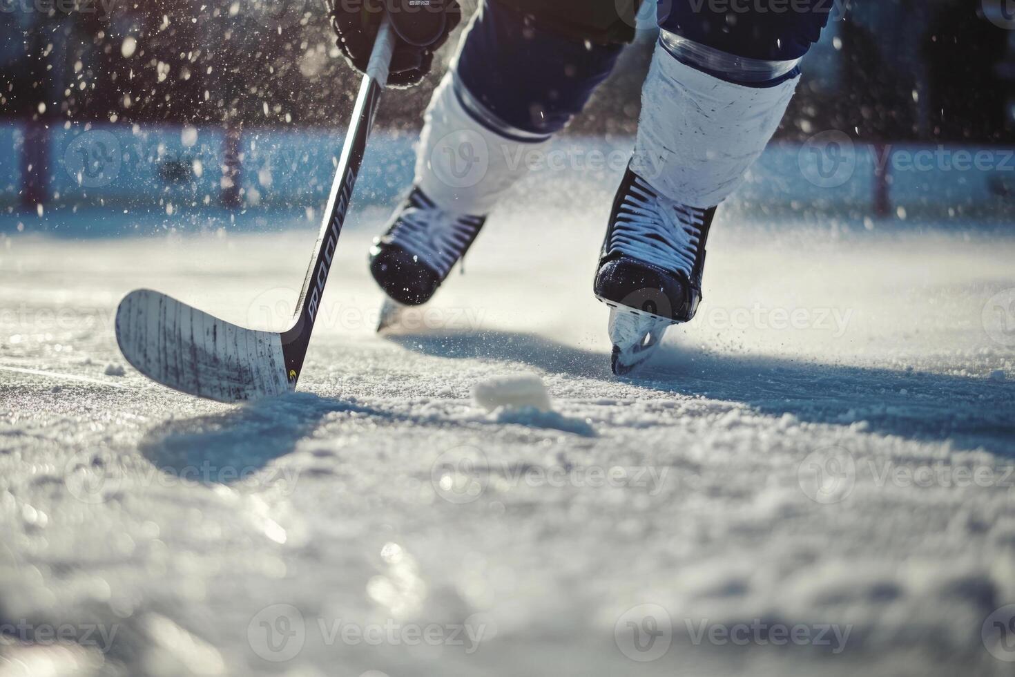 Hockey player skating on ice rink during match photo