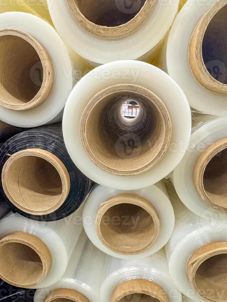 Stacked Industrial Plastic Wrap Rolls for Packaging and Shipping Supplies . High quality photo