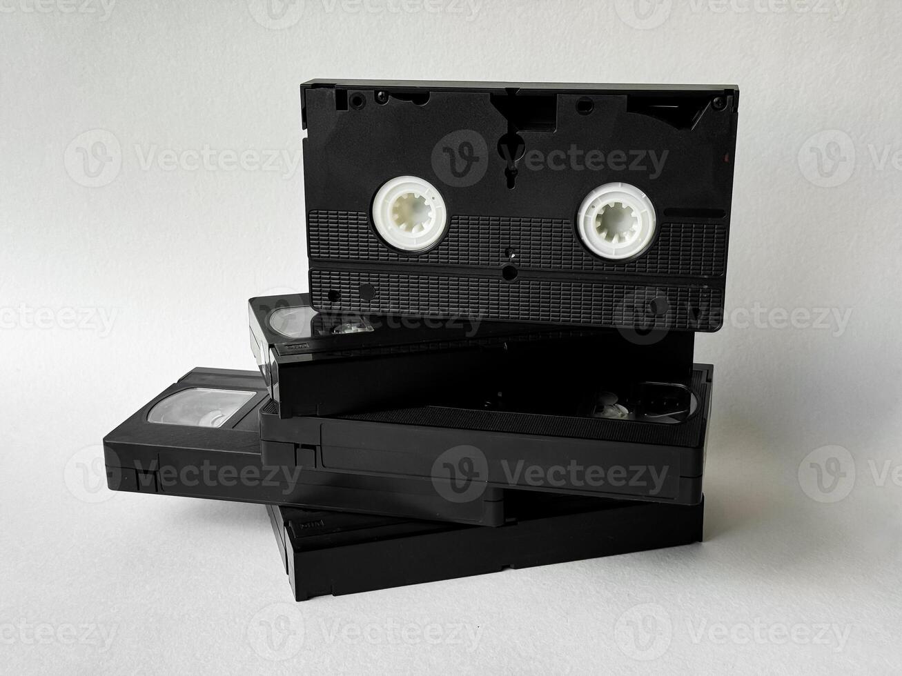 Stack of vintage vhs tapes on a white background highlighting retro media photo
