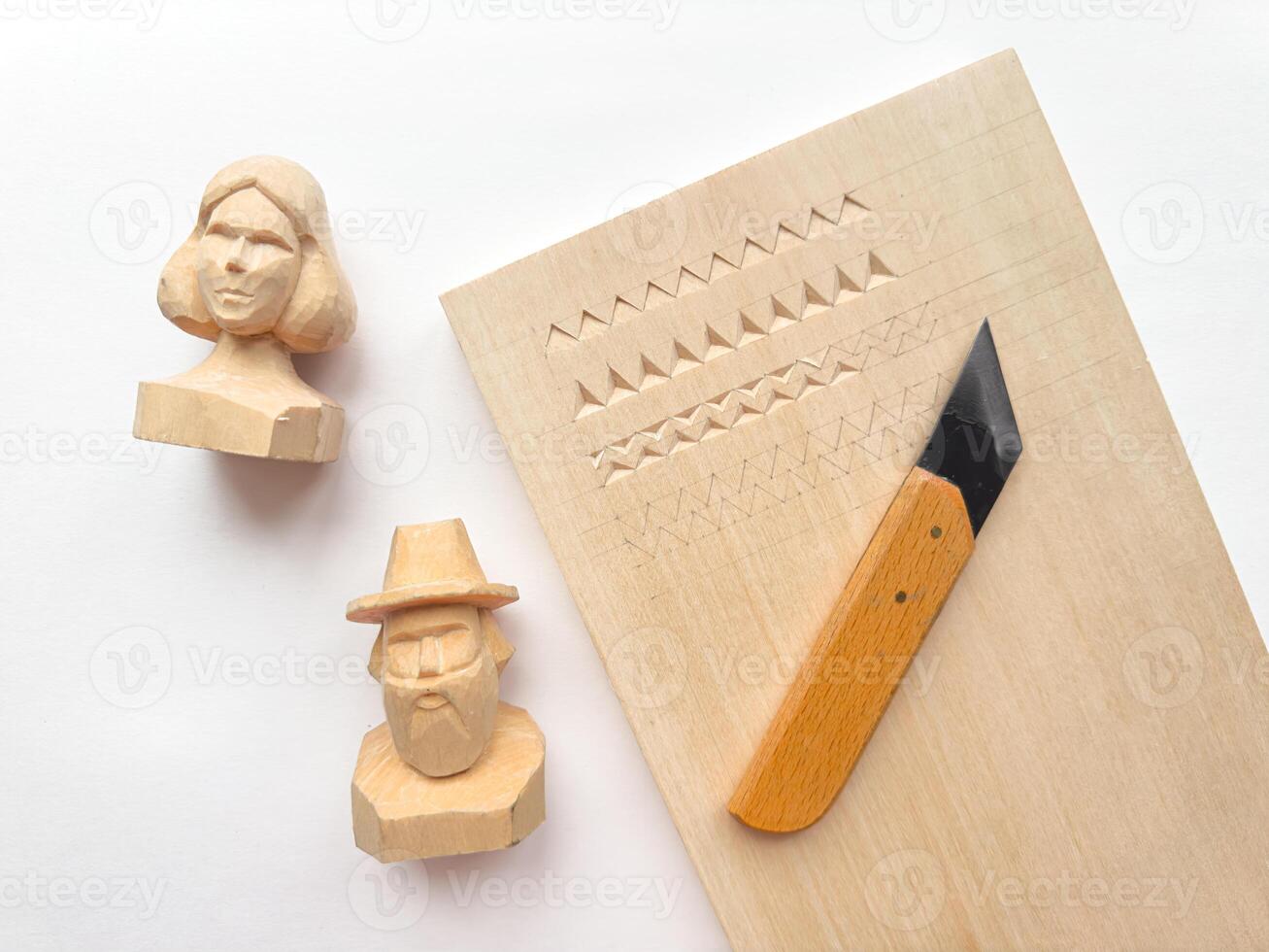 Wood carving art with geometric patterns and handcrafted figures photo