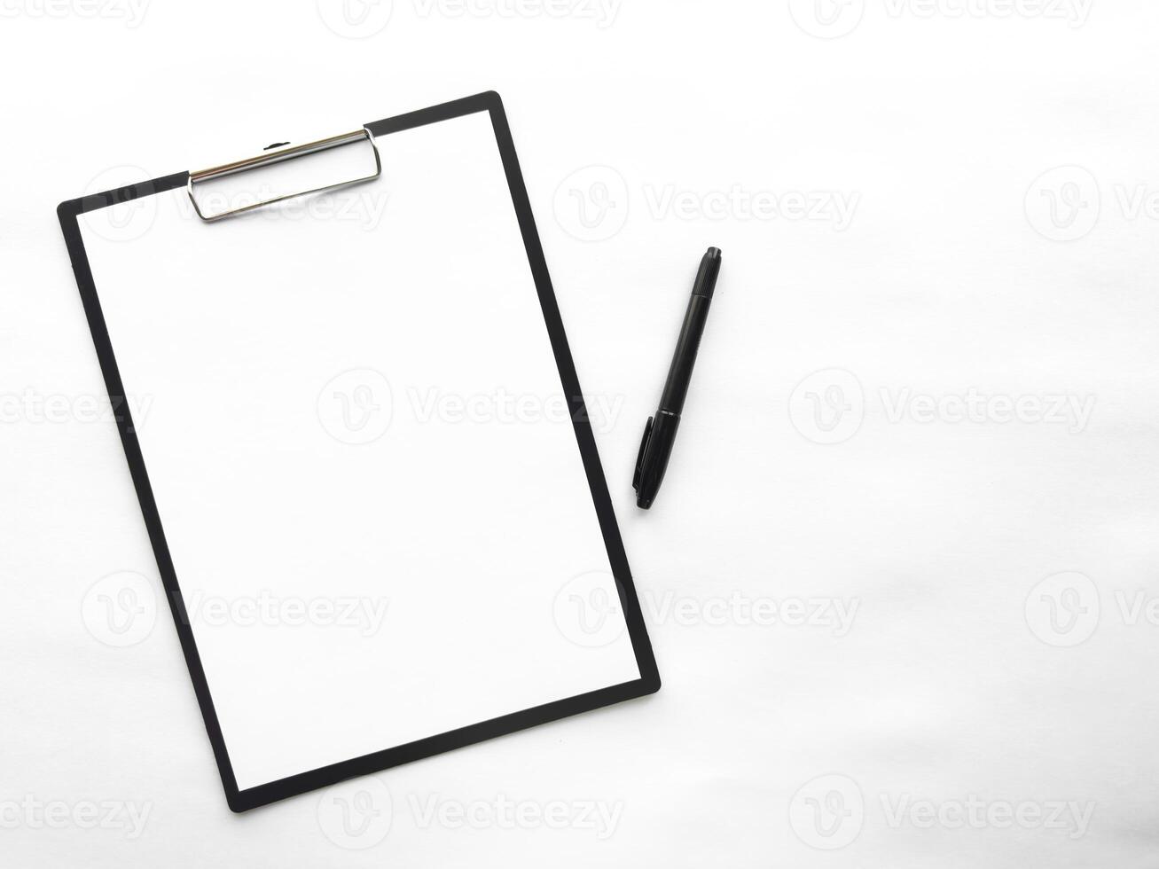 Minimalist clipboard with blank paper and pen on white background photo