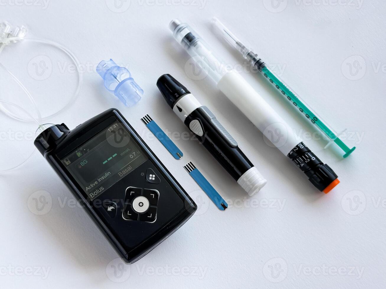Diabetes management tools, insulin pump, pen, and syringe essentials photo