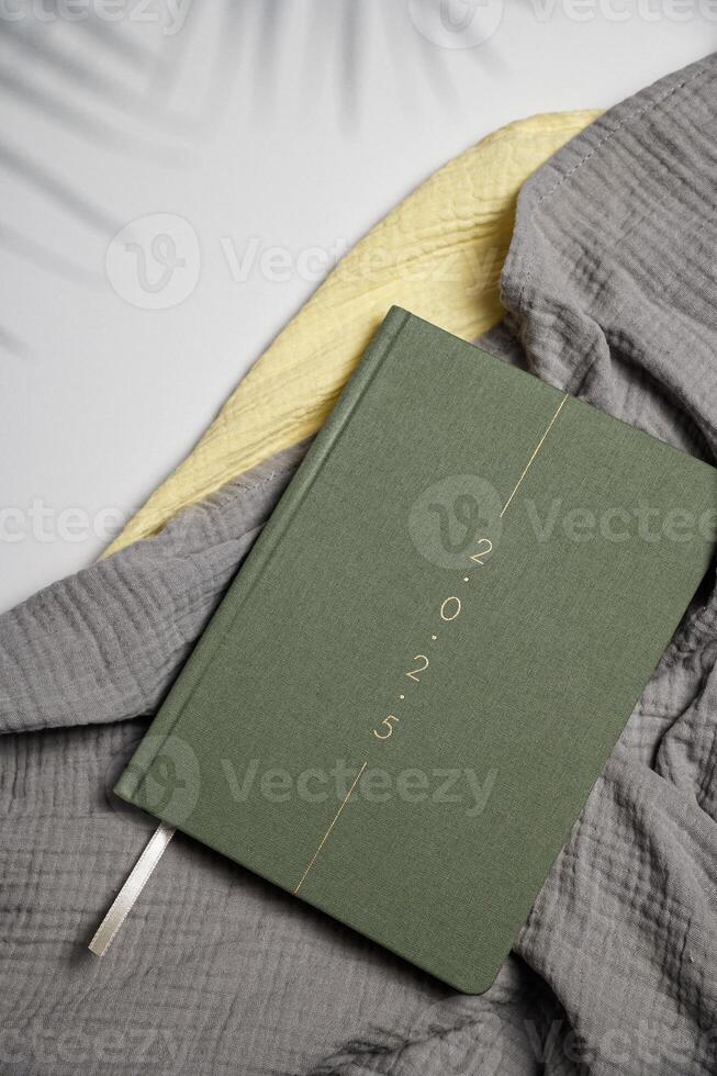 Flat lay of green notebook. Top view photo