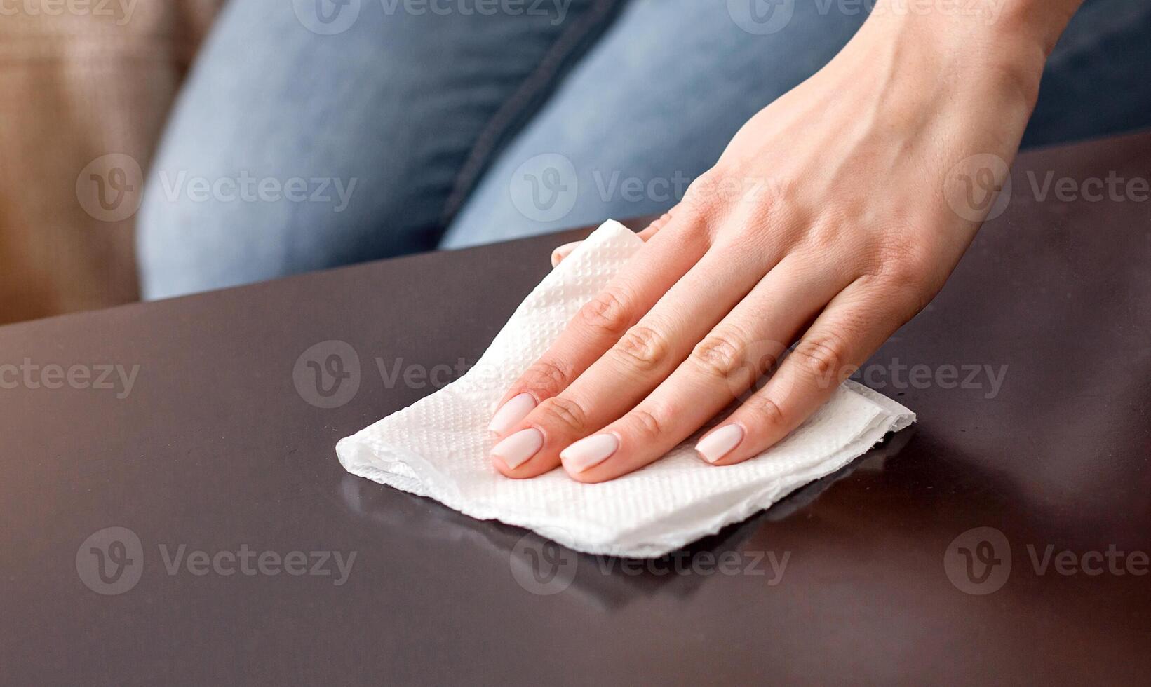 Cleanliness in house. Woman wipes table with napkin, cropped photo