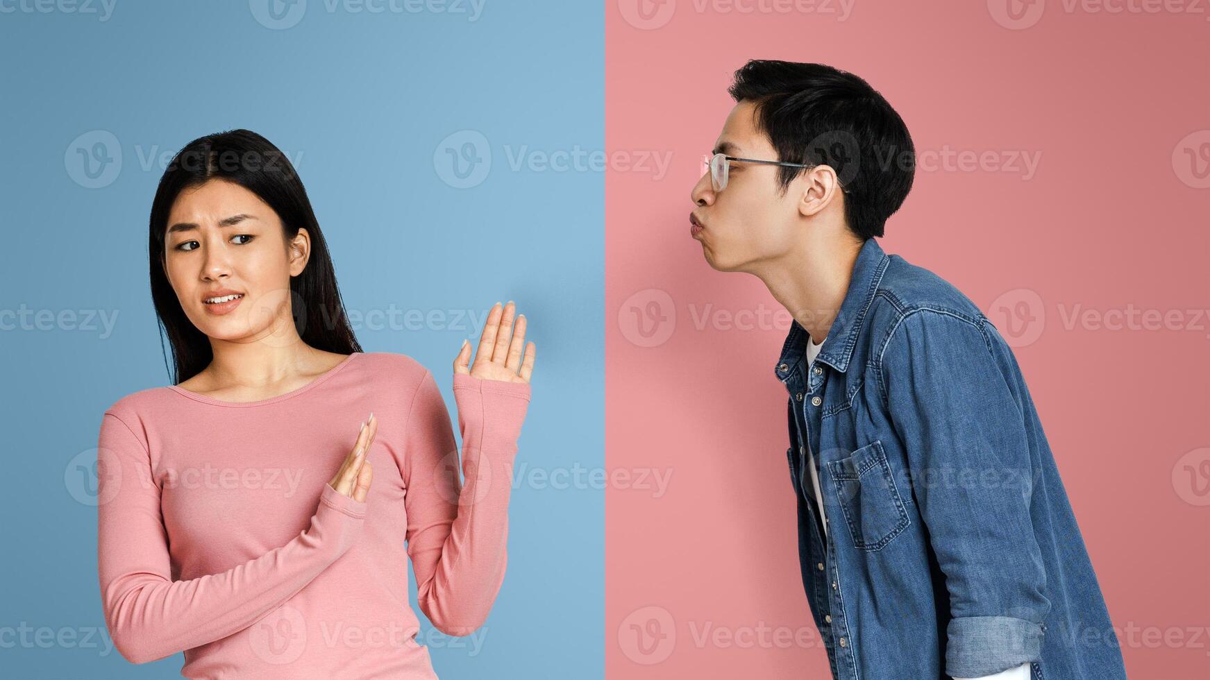 Virus Anxiety. Annoyed Chinese Woman Rejecting Kisses From Her Boyfriend, Afraid Of Coronavirus Spread, Standing Over Light Background, Free Space photo