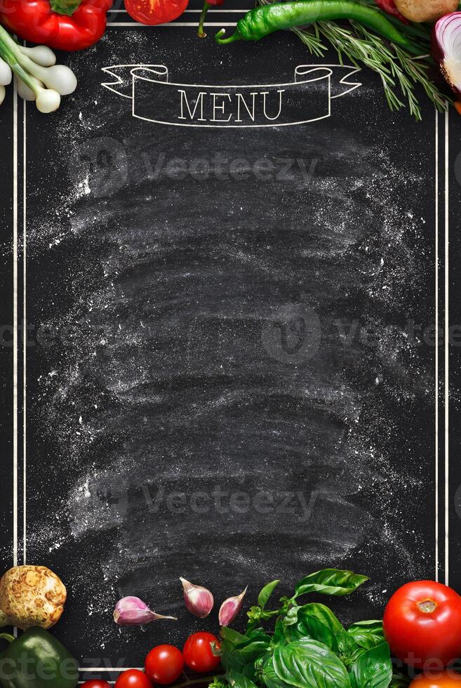 Design concept for restaurant menu mockup. Black rustic chalkboard with white inscription and vegetables frame, top view, copy space for text and logo, vegetarian cafe concept photo