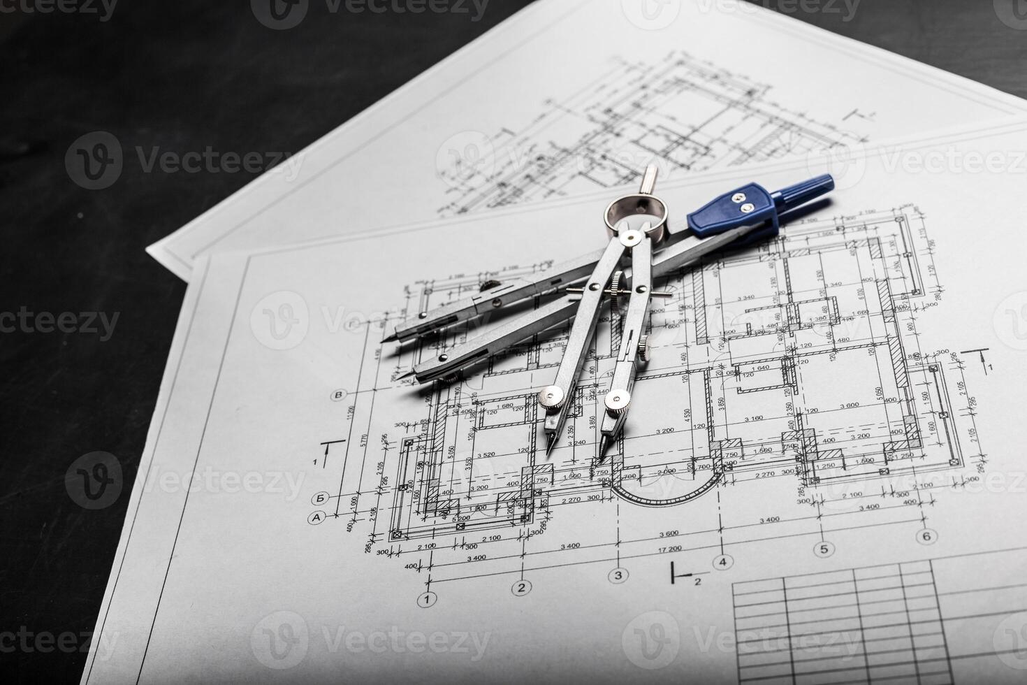 Construction planning drawings on black background photo