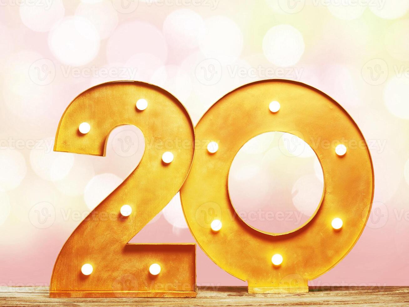 Big plastic numbers with shining light bulbs photo