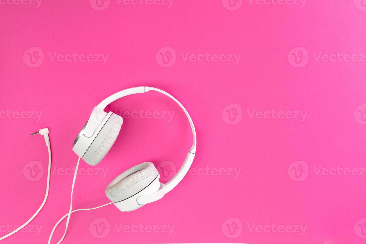 headphones on pink background photo