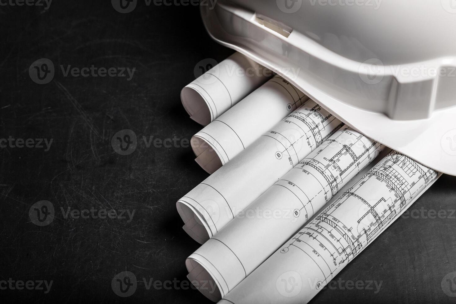 Construction planning drawings on black background photo
