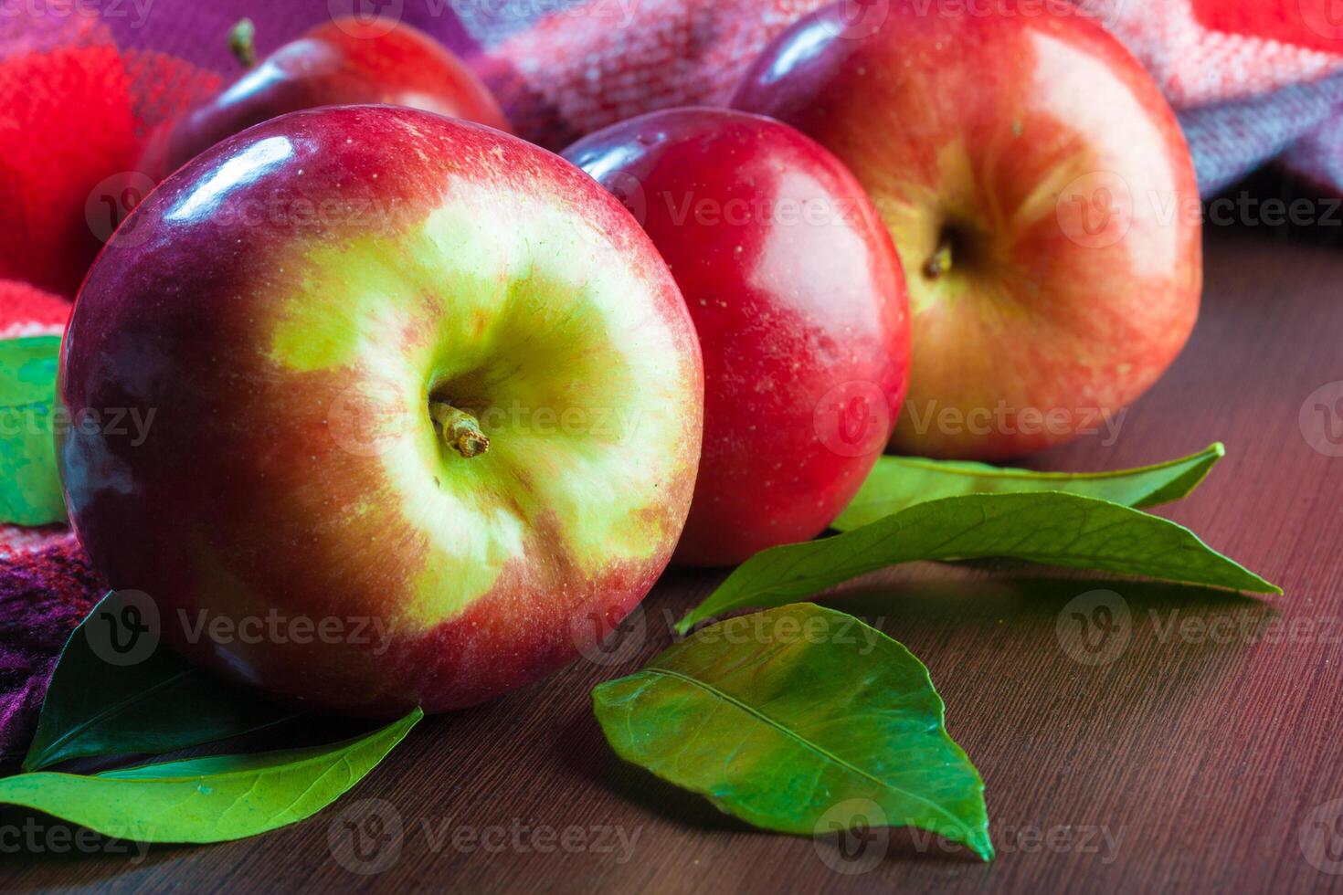 red apples on table close up photo