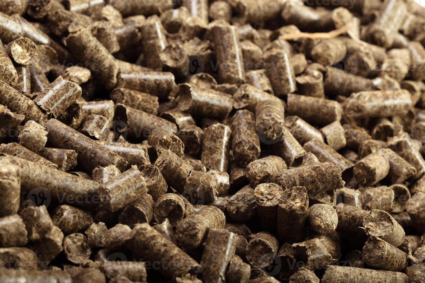 Wood pellets in the background. photo