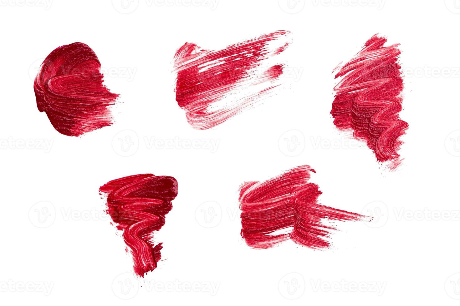 Lipstick paint strokes isolated on white photo