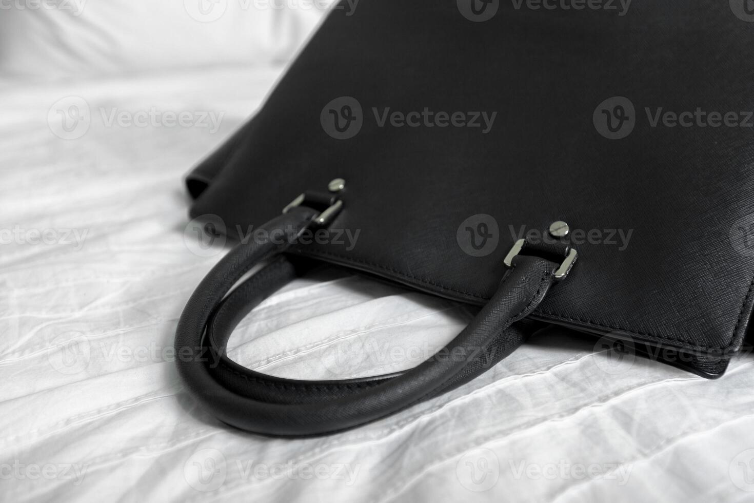 Female bag on white textile photo