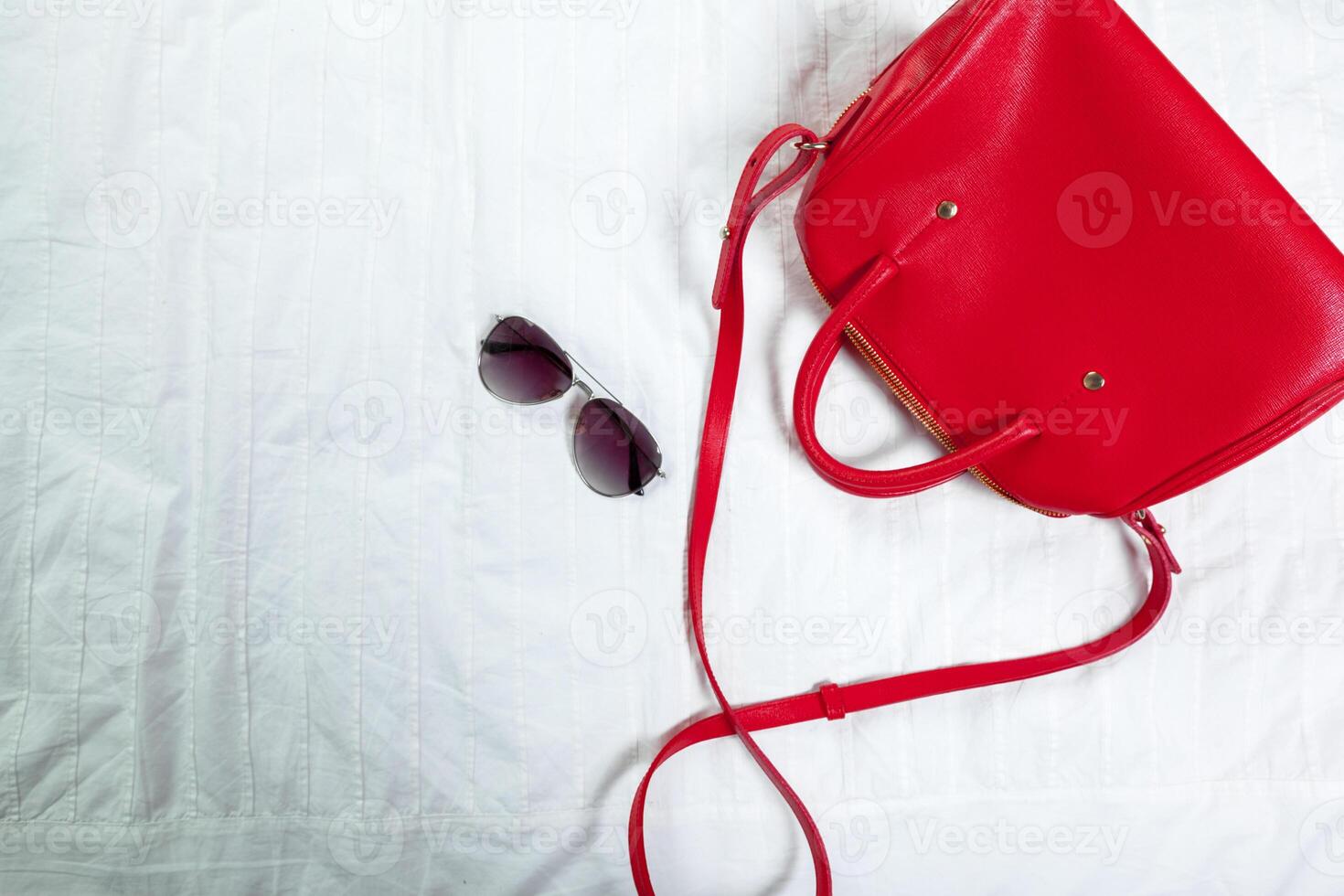 Female bag on white textile photo